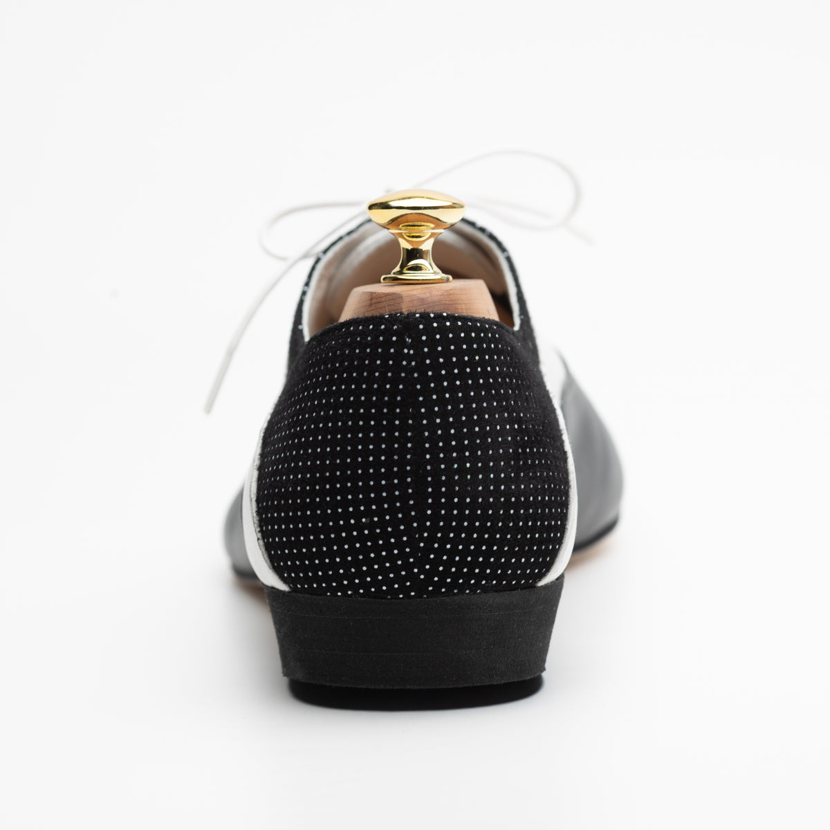 Back view of the Mono El Smoking tango oxford showing the black suede heel panel with its fine white micro-dot pattern