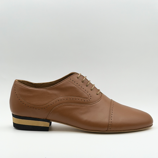 Side profile of the Mono Tabacco men's tango oxford in tobacco-brown leather, showing the perforated cap toe, curved side broguing, closed lacing, and striped low heel